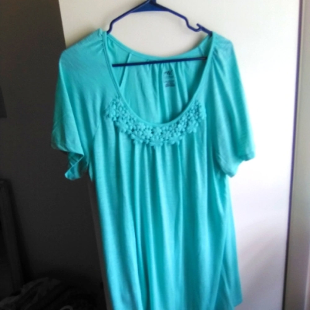 Teal tee with flowers at neckline